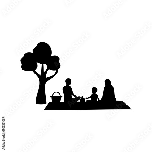 Family silhouette enjoying picnic under tree together happily outdoors