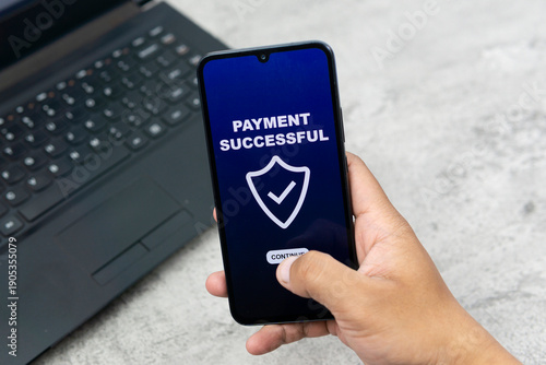Payment by phone technology concept. Hand holding smartphone to pay for shopping, digital online transactions, sales,  and finances via mobile apps. A modern lifestyle with electronic cards and networ