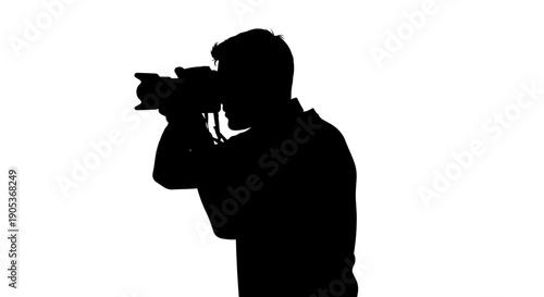 Silhouette of a photographer capturing a moment with a professional camera.