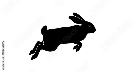 Silhouette of a rabbit in midair jump.
