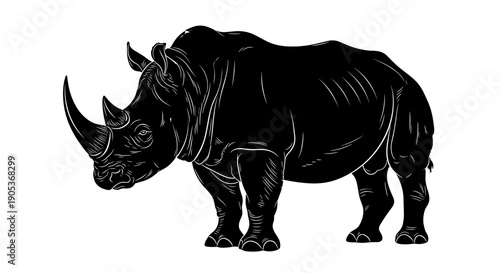 Silhouette of a powerful rhinoceros standing majestically.