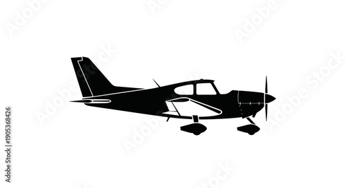 Silhouette of a Small Propeller Aircraft in Flight 1.