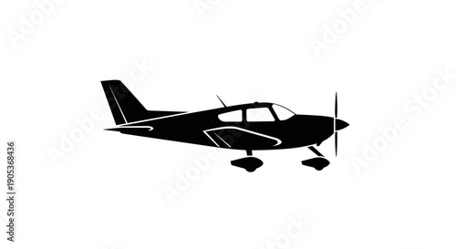 Silhouette of a Small Propeller Aircraft in Flight.