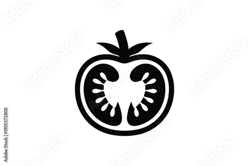 Ripe tomato cut in half displaying internal structure with seeds and pulp, fresh produce ingredient