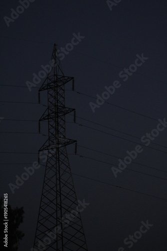 A Large Electrical Transmission Tower at Dusk

