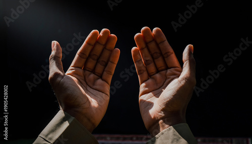 Hands open upwards in prayer, bathed in a gentle light, symbolizing hope, faith, and a deep spiritual connection, offering a moment of serene devotion and reflection