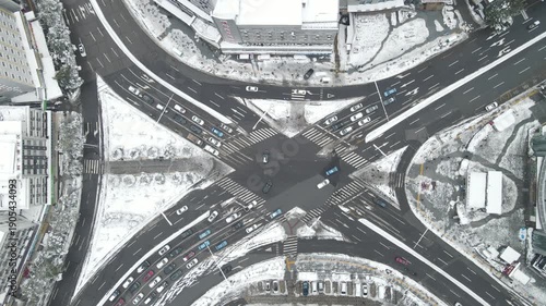 Aerial Winter City Intersection with Heavy Traffic and Snow