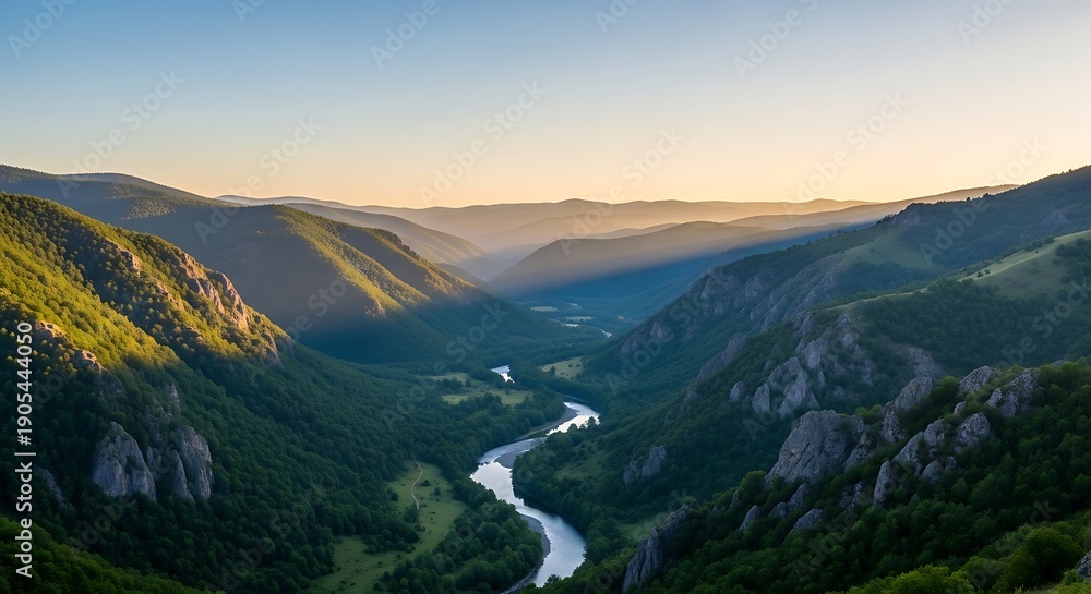 Naklejka premium Wide valley with winding river and sunlit green mountains at dawn nature landscape