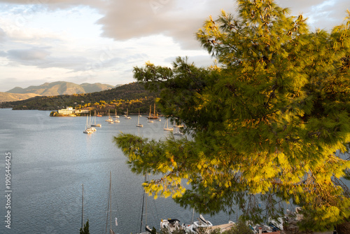 Poros Island bay and harbor view with traditional seaside town and calm Mediterranean waters, Greece.