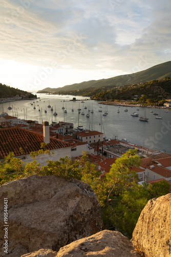 Poros Island bay and harbor view with traditional seaside town and calm Mediterranean waters, Greece.