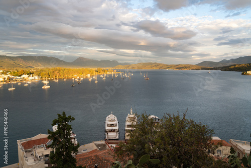 Poros Island bay and harbor view with traditional seaside town and calm Mediterranean waters, Greece.