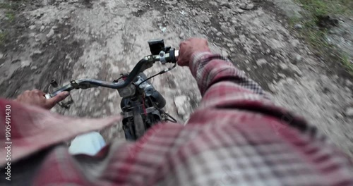 Mountain Biker Riding Down a Rocky Trail.