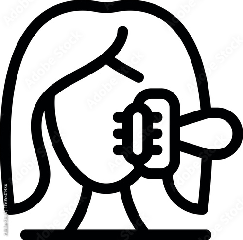 Woman taking care of her long hair, brushing it with an oval hairbrush, as part of her daily beauty routine