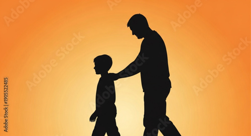 Father and son walking together silhouette against orange background.