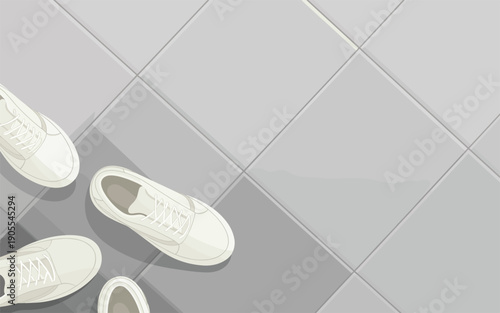 Aerial view of white sneakers arranged on a gray tiled floor, showcasing footwear in a minimalist setting