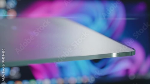 A close-up view of a computer screen with a blurred background of colorful lights