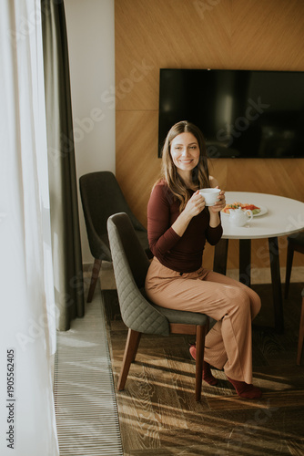 Woman enjoying coffee and s...