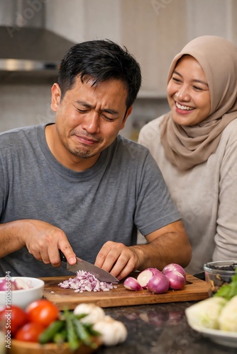 photo of husband slicing onions and his wife smiling