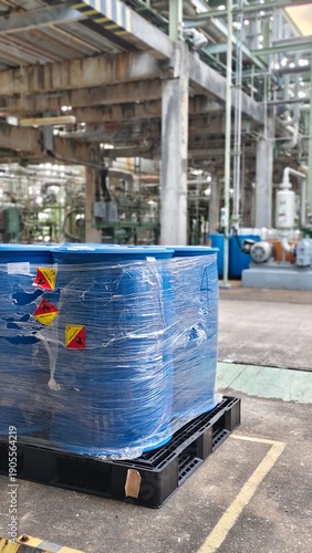 Flammable material stored in 200-liter tanks in an industrial plant.