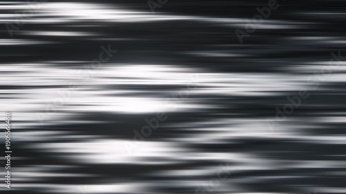 Reflets et ondulations du soleil sur l'eau au ralenti, avec effet flou gaussien horizontal