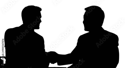 Silhouette of two people shaking hands in a professional setting