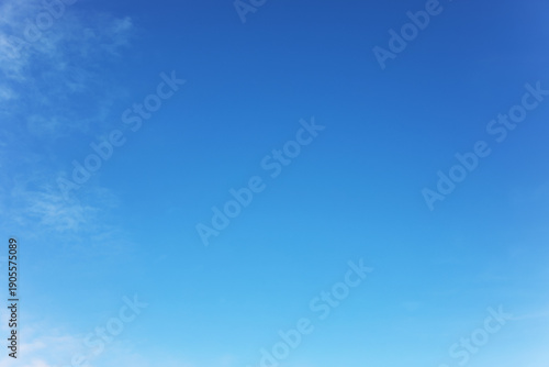 Blue sky background and white clouds soft focus, and copy space horizontal shape.