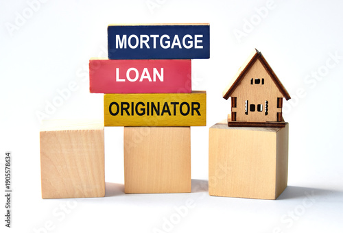 MORTGAGE LOAN ORIGINATOR - words on colored wooden blocks on a white background with a house
