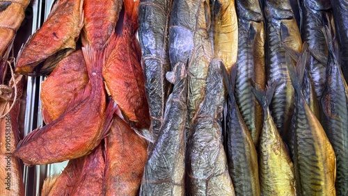 Photos Fish market display case with hot smoked sea perch, smoked chum salmon, and herr