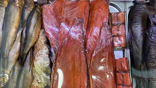 Tableau sur toile Cold smoked chum salmon and other smoked fish on display in market