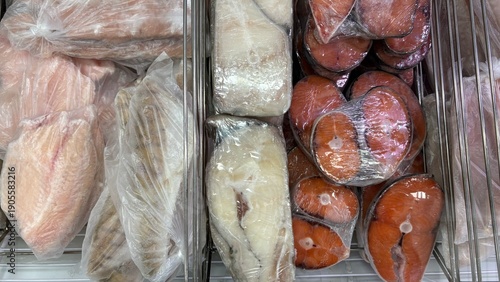 Fotografie Fish market display with packaged fish and seafood products