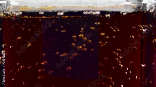 closeup of soda in a glass, fizzy cola, glass of soda, cola bubbles