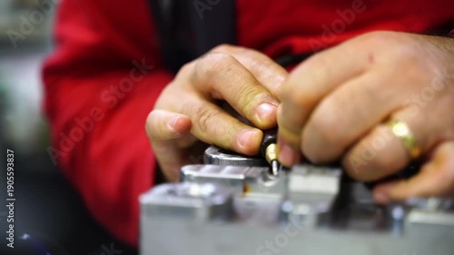 Close-up of a master welder repairing a worn-out plastic injection mold in a factory. Concept of industrial maintenance, engineering precision, and business finance efficiency.