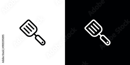 Black and white spatula on contrasting backgrounds cooking utensil kitchen tool minimalist
