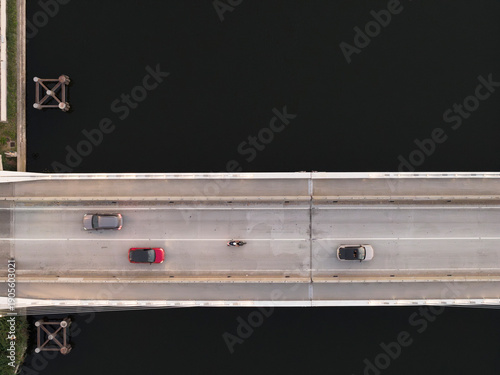 Wallpaper Mural Top down view of a cars  driving on a bridge over the water, The Ravenna Mobile Bridge, connects Via Romea Nord to the Pala De Andrè, Candiano canal, Ravenna,Italy Torontodigital.ca