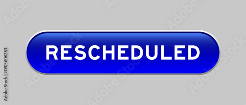 Blue color capsule shape button with word rescheduled on gray background
