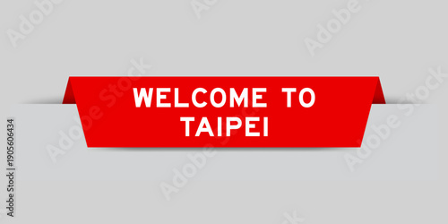Red color inserted label with word welcome to taipei on gray background