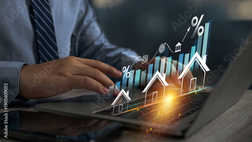 Real estate revenue graph growth. Businessman hand touching on a  graph and growing arrow.Increase asset and profit with house icon, analyzing investment diagram, achievement in business.