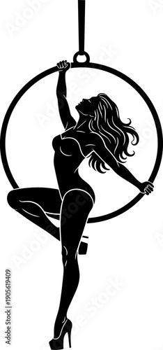 Silhouette of a graceful female aerialist with long flowing hair performing an elegant pose on a hanging hoop ring, ideal for circus and performance arts.
