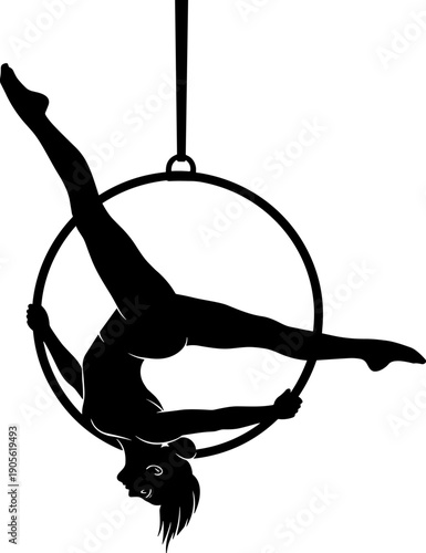 Silhouette of female aerialist performing acrobatic split on hanging hoop ring, circus performer demonstrating strength and flexibility in mid air.
