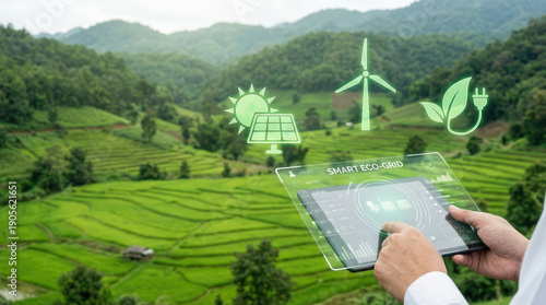 Person using digital tablet to monitor smart eco grid system lush, green agricultural landscape. image features icons representing solar energy, wind power, and sustainable technology