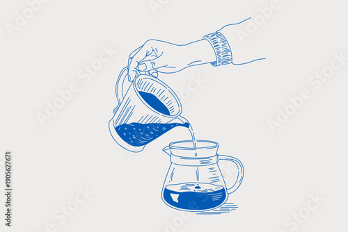 Hand pouring coffee from carafe to pour over coffee maker for brewing fresh hot beverage