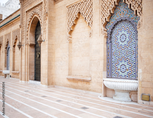 Wallpaper Mural Ornate architectural wall featuring intricate patterns and colorful tile work, with a serene courtyard and elegant stone pathways, showcasing traditional craftsmanship and cultural heritage Torontodigital.ca