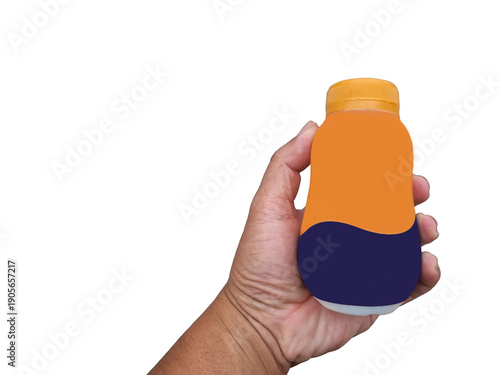 Hand holding small plastic bottle colorful label design. Bottle orange, blue, white sections, clean white background, packaging mockups, advertisements, and marketing materials. advertisement