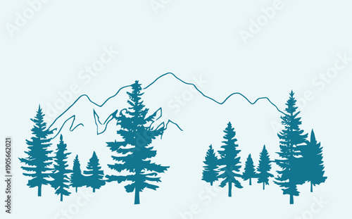Evergreen trees in front of a mountain range landscape