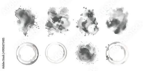 A collection of grunge-style watercolor splotches and coffee cup stain rings in shades of gray on a white background