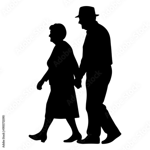 Silhouette of an elderly couple walking hand in hand