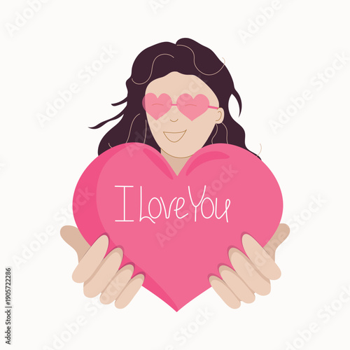 Happy girl holding a pink heart with the inscription, text. I love you. Valentine's Day. Postcard, Valentine. Woman in glasses, heart in her palms. Isolated background.