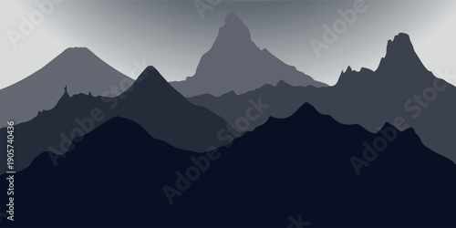 Dark blue and grey layered mountain range silhouette