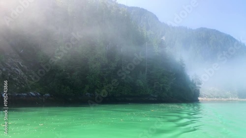 Knight Inlet, Vancouver Island. Boat on the misty water. Canada