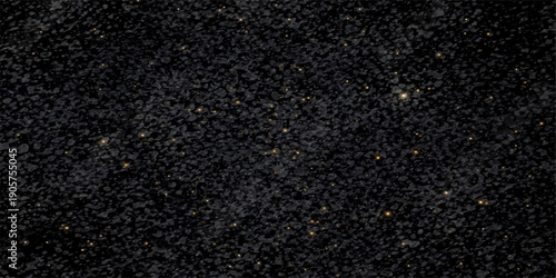 A closeup of a dark grey asphalt road surface showing the rough texture and detail of black stone and bitumen material as an abstract pattern for a tarmac background wallpaper